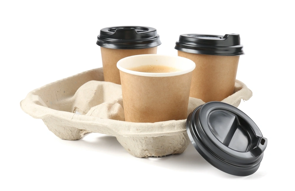 Paper coffee cups in a cardboard holder.
